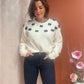 Pull blanc avec nœuds papillon