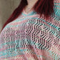 "Pull ajouré multicolore : éclat de couleurs. Ce pull vibrant et léger, avec ses motifs ajourés et ses teintes variées, apporte une touche de gaieté et de dynamisme à votre tenue, idéal pour illuminer vos journées d'une touche de couleur."
