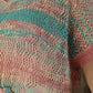 "Pull ajouré multicolore : éclat de couleurs. Ce pull vibrant et léger, avec ses motifs ajourés et ses teintes variées, apporte une touche de gaieté et de dynamisme à votre tenue, idéal pour illuminer vos journées d'une touche de couleur."