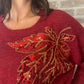 Pull bordeaux fleur sequin